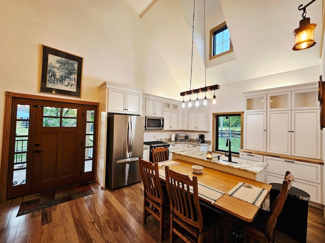 1240 Beath Ln, South Salem, OH 45681 - dining space featuring high vaulted ceiling and dark wood-type flooring