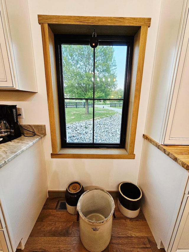 1240 Beath Ln, South Salem, OH 45681 - kitchen view of white cabinetry, wood finished floors, and light countertops