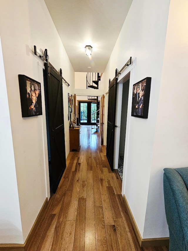 1240 Beath Ln, South Salem, OH 45681 - hallway with a barn door and hardwood / wood-style flooring