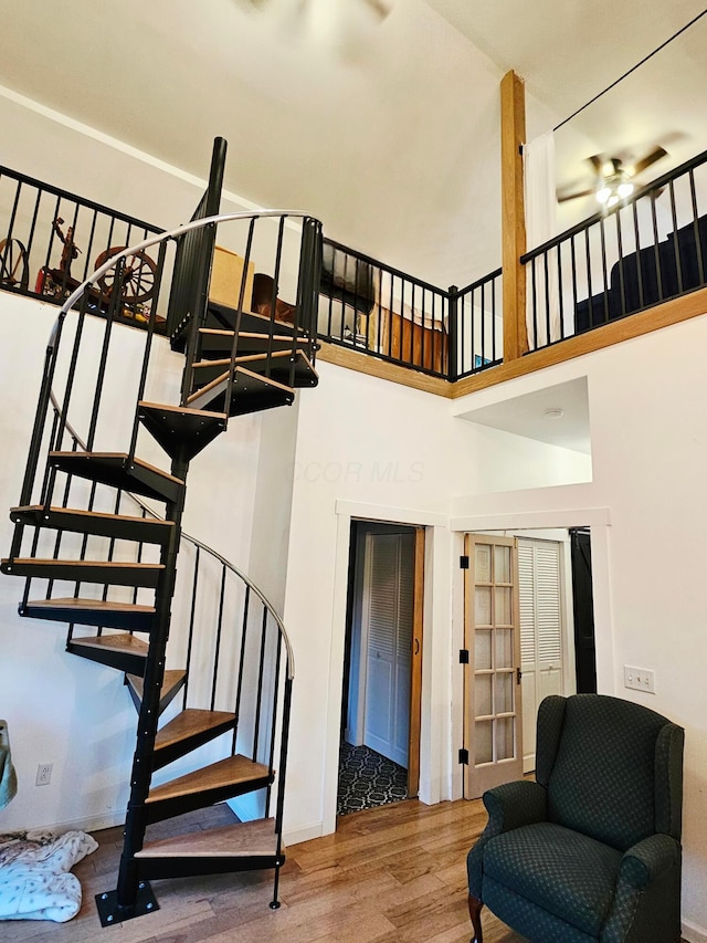 1240 Beath Ln, South Salem, OH 45681 - staircase featuring wood finished floors and a ceiling fan