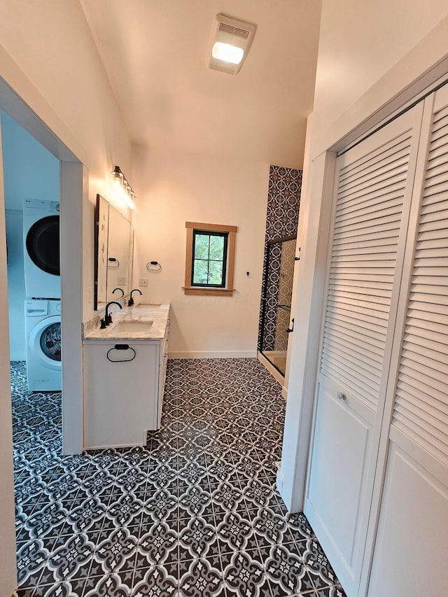 1240 Beath Ln, South Salem, OH 45681 - full bathroom featuring a closet, stacked washer and clothes dryer, vanity, and a stall shower