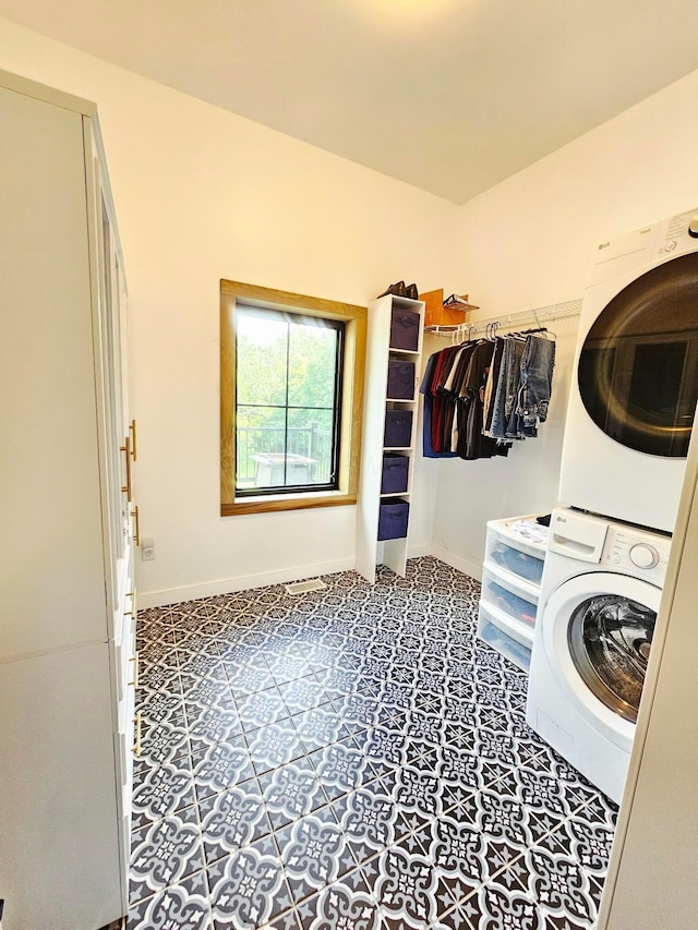 1240 Beath Ln, South Salem, OH 45681 - laundry room featuring stacked washer / dryer and tile patterned floors