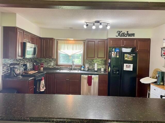 10363 Bremen Rd, Logan, OH 43138 - kitchen featuring black appliances, dark countertops, and tasteful backsplash