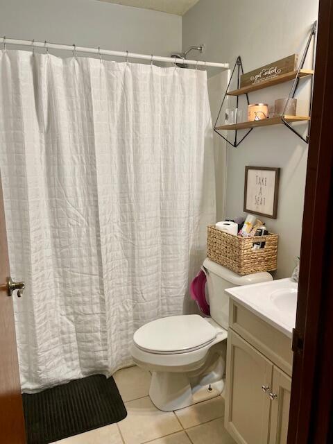 10363 Bremen Rd, Logan, OH 43138 - bathroom featuring vanity, tile patterned floors, and a shower with shower curtain