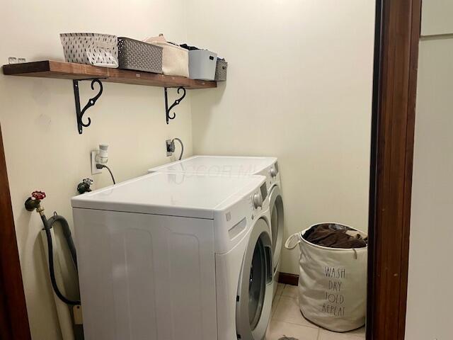 10363 Bremen Rd, Logan, OH 43138 - laundry room featuring washer and clothes dryer and light tile patterned floors