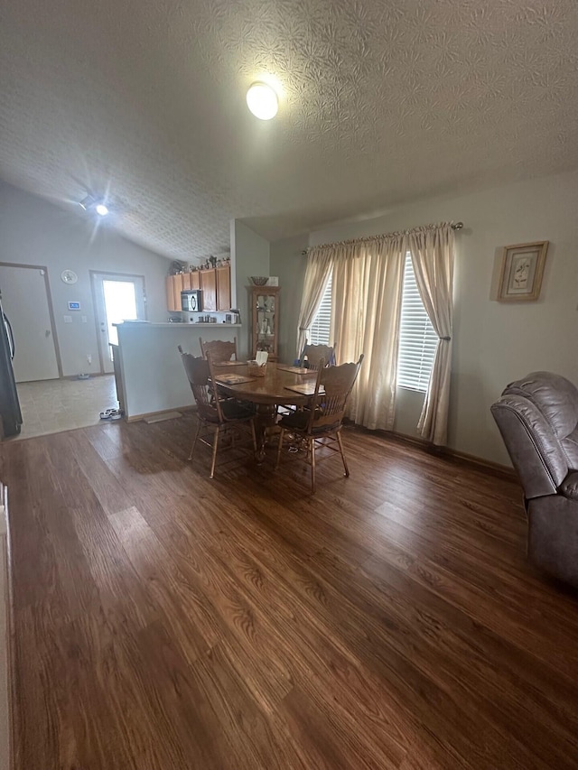 5393 Blanchard Dr, Canal Winchester, OH 43110 - dining space featuring wood finished floors, a textured ceiling, and vaulted ceiling