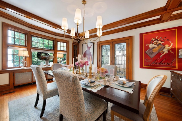 2465 E Broad St, Bexley, OH 43209 - dining space with a chandelier, wood finished floors, radiator heating unit, and beamed ceiling