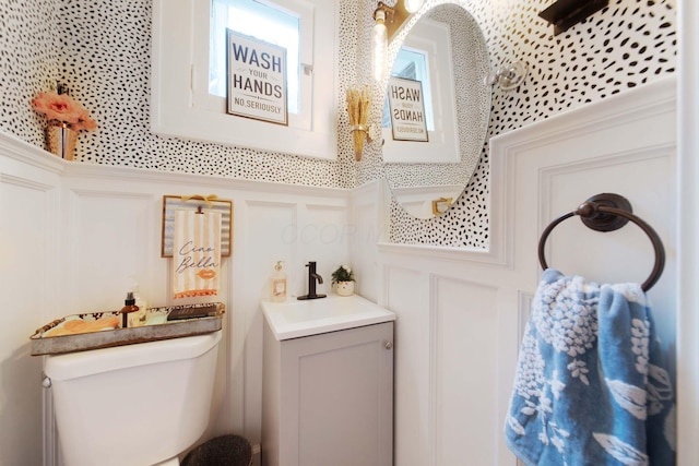2465 E Broad St, Bexley, OH 43209 - bathroom featuring a decorative wall and vanity