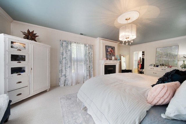 2465 E Broad St, Bexley, OH 43209 - bedroom featuring light carpet, a chandelier, ornamental molding, a spacious closet, and a closet