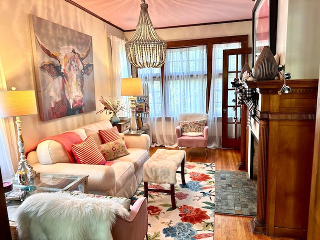 2465 E Broad St, Bexley, OH 43209 - living area with wood finished floors, a chandelier, and crown molding