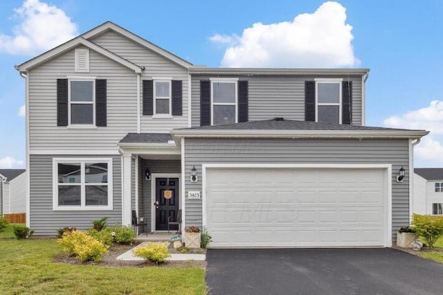 5423 Morning Glory St, South Bloomfield, OH 43103 - view of front of home featuring asphalt driveway and a garage
