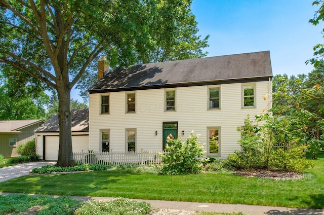 1133 Rockport Ln, Columbus, OH 43235 - colonial inspired home featuring a chimney, an attached garage, driveway, and a shingled roof