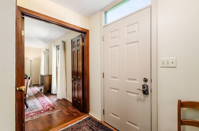 1133 Rockport Ln, Columbus, OH 43235 - foyer entrance featuring dark wood-type flooring and baseboards