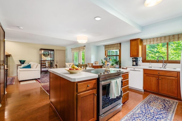 1133 Rockport Ln, Columbus, OH 43235 - kitchen with dishwasher, stainless steel range with electric stovetop, light countertops, light wood finished floors, and recessed lighting