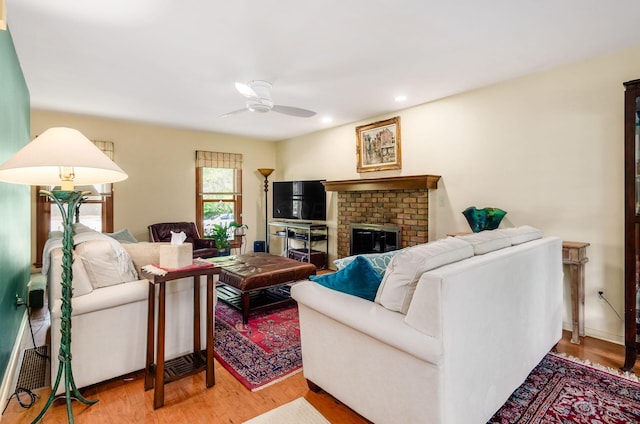 1133 Rockport Ln, Columbus, OH 43235 - living room with ceiling fan, light wood-style floors, a fireplace, and recessed lighting