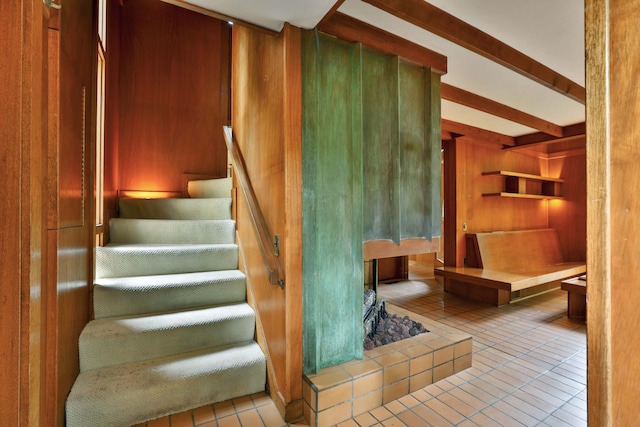 230 E S St, Worthington, OH 43085 - staircase featuring wooden walls, tile patterned flooring, and beamed ceiling