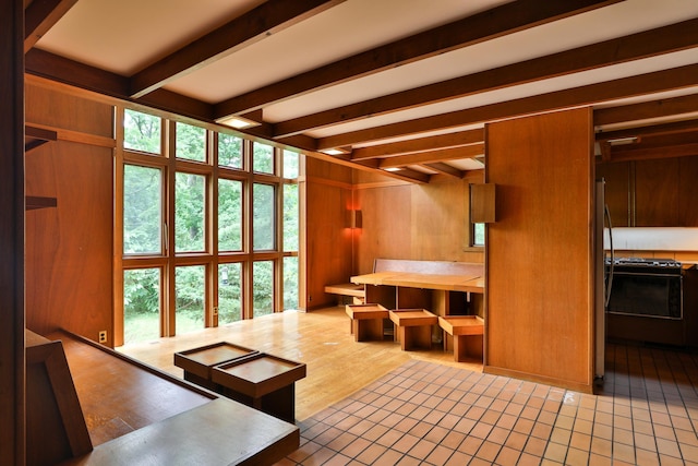 230 E S St, Worthington, OH 43085 - interior space featuring beam ceiling, healthy amount of natural light, and wood walls