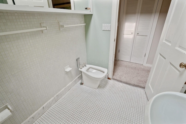 161 Jackson St, Columbus, OH 43206 - bathroom featuring a bidet and tile patterned flooring