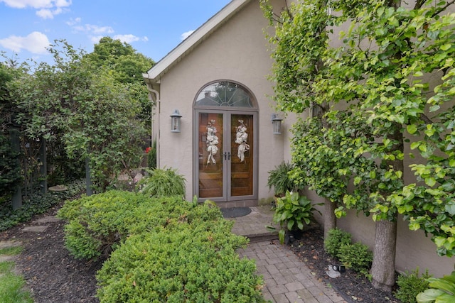 161 Jackson St, Columbus, OH 43206 - view of exterior entry with stucco siding and french doors