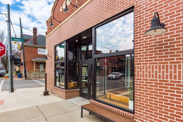 161 Jackson St, Columbus, OH 43206 - view of exterior entry featuring brick siding