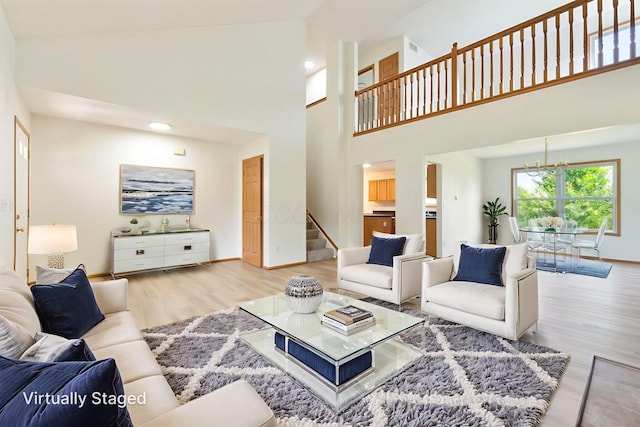 113 Olentangy Meadows Dr, Lewis Center, OH 43035 - living room with a chandelier, wood finished floors, stairway, a high ceiling, and recessed lighting