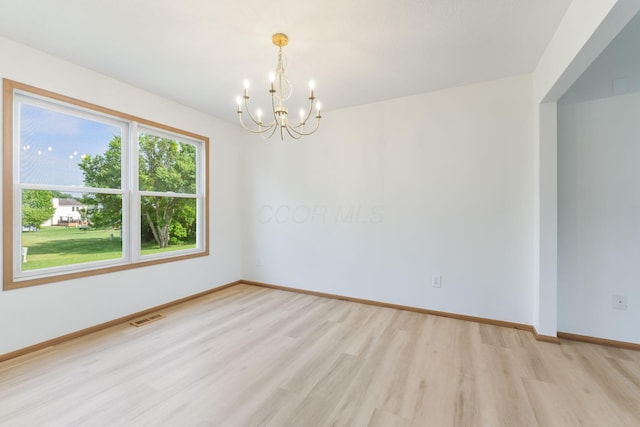 113 Olentangy Meadows Dr, Lewis Center, OH 43035 - spare room featuring light wood-type flooring and a chandelier