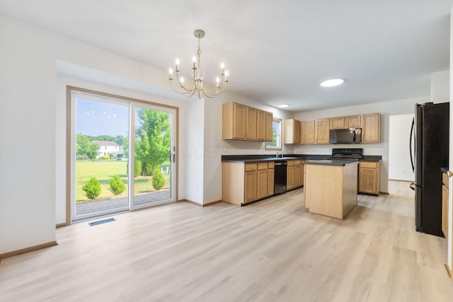 113 Olentangy Meadows Dr, Lewis Center, OH 43035 - kitchen with dishwashing machine, freestanding refrigerator, dark countertops, a chandelier, and a center island