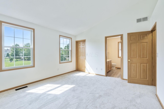 113 Olentangy Meadows Dr, Lewis Center, OH 43035 - unfurnished bedroom with light carpet, vaulted ceiling, and ensuite bath