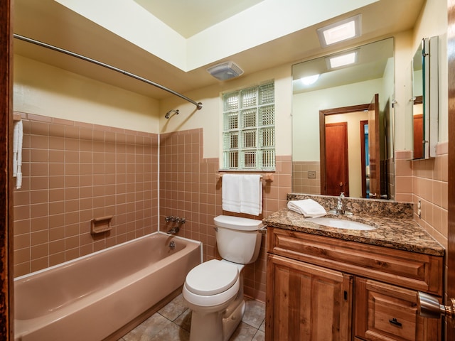 1530 Pemberton Dr, Columbus, OH 43221 - full bath with tile patterned floors, tile walls,  shower combination, vanity, and wainscoting