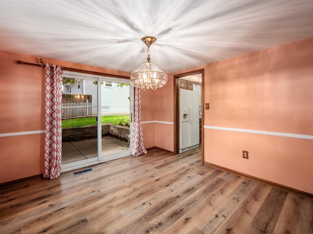 1530 Pemberton Dr, Columbus, OH 43221 - unfurnished dining area featuring a chandelier and wood finished floors