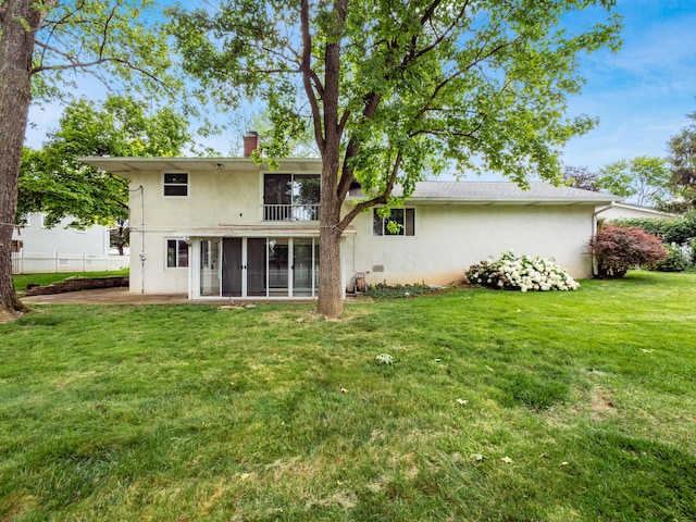 1530 Pemberton Dr, Columbus, OH 43221 - rear view of property featuring stucco siding, a sunroom, a chimney, and a balcony