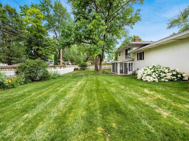 1530 Pemberton Dr, Columbus, OH 43221 - fenced backyard featuring a sunroom