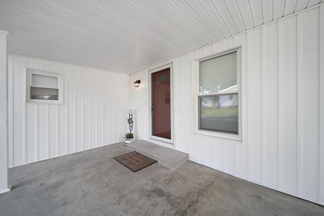 11 E Main St, Sparta, OH 43350 - property entrance with board and batten siding