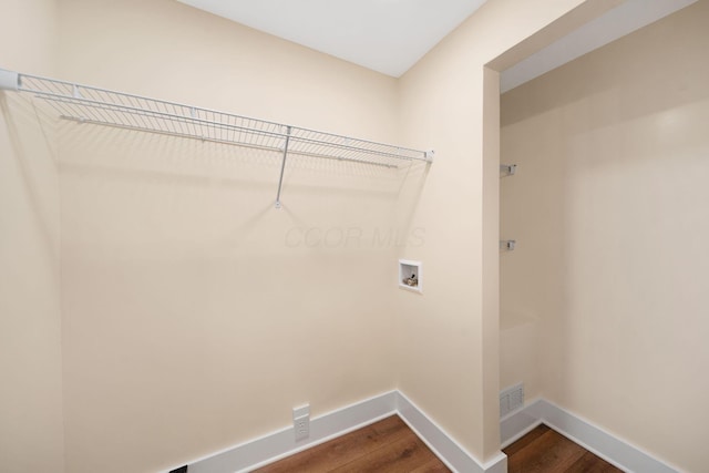 11 E Main St, Sparta, OH 43350 - laundry room featuring dark wood finished floors and washer hookup
