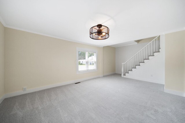 11 E Main St, Sparta, OH 43350 - unfurnished living room featuring light carpet, stairway, and ornamental molding