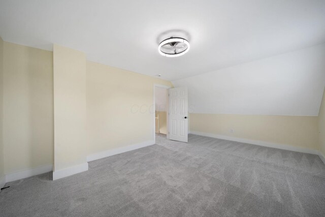11 E Main St, Sparta, OH 43350 - carpeted spare room featuring lofted ceiling and baseboards