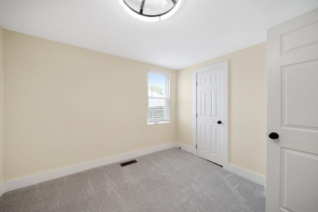 11 E Main St, Sparta, OH 43350 - unfurnished bedroom with light carpet and baseboards