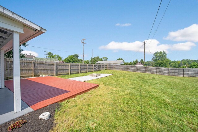 11 E Main St, Sparta, OH 43350 - fenced backyard featuring a wooden deck