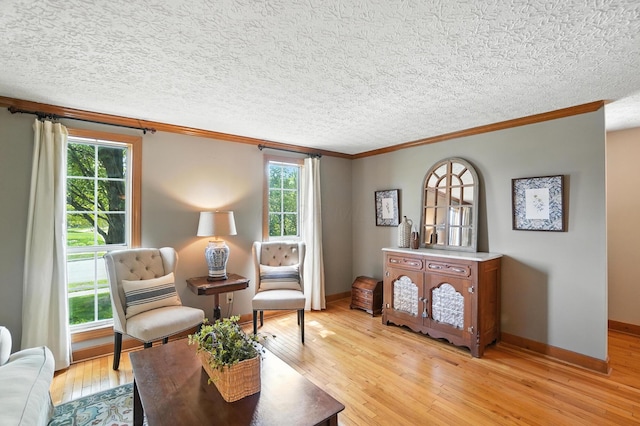 1482 Buckpoint Ln, Worthington, OH 43085 - sitting room featuring ornamental molding, light wood-style floors, and a textured ceiling