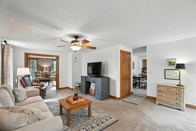 1482 Buckpoint Ln, Worthington, OH 43085 - living area featuring ceiling fan, a textured ceiling, and light colored carpet
