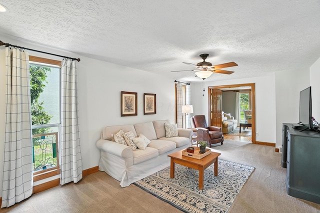 1482 Buckpoint Ln, Worthington, OH 43085 - carpeted living room with ceiling fan and a textured ceiling