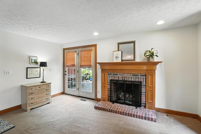 1482 Buckpoint Ln, Worthington, OH 43085 - carpeted living area with recessed lighting, a textured ceiling, and a brick fireplace