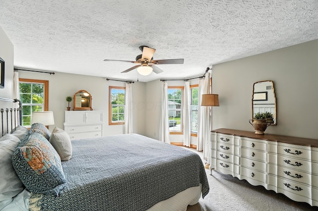 1482 Buckpoint Ln, Worthington, OH 43085 - bedroom featuring carpet floors, a textured ceiling, and a ceiling fan