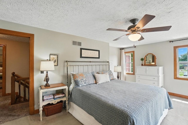 1482 Buckpoint Ln, Worthington, OH 43085 - carpeted bedroom featuring a textured ceiling and a ceiling fan