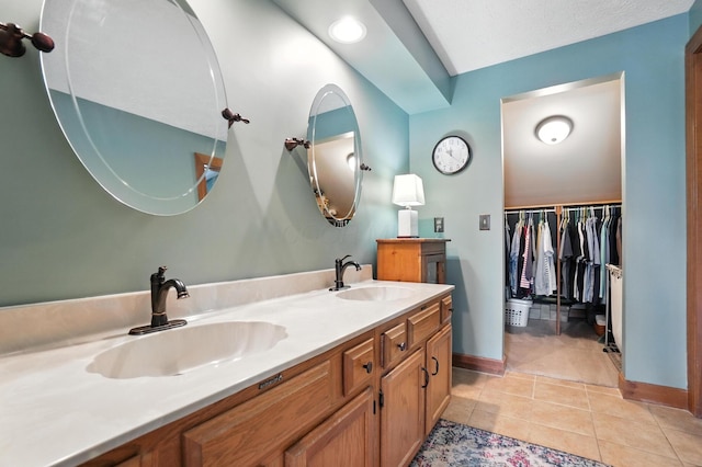 1482 Buckpoint Ln, Worthington, OH 43085 - full bath with double vanity, tile patterned floors, and a walk in closet