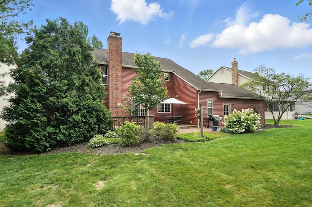 1482 Buckpoint Ln, Worthington, OH 43085 - rear view of house with a chimney, a lawn, and roof with shingles