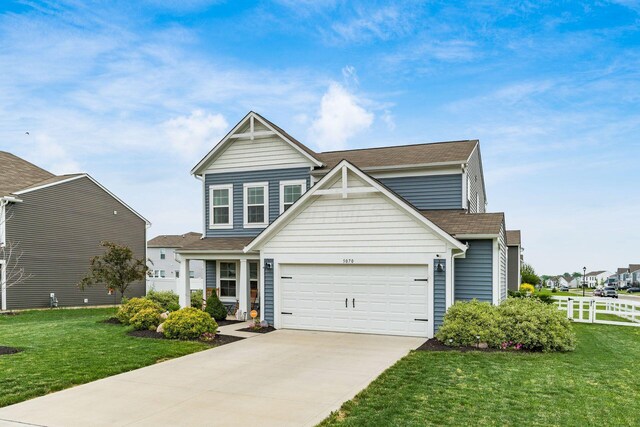 5070 River Bend Dr, South Bloomfield, OH 43103 - traditional-style home with driveway, roof with shingles, and an attached garage