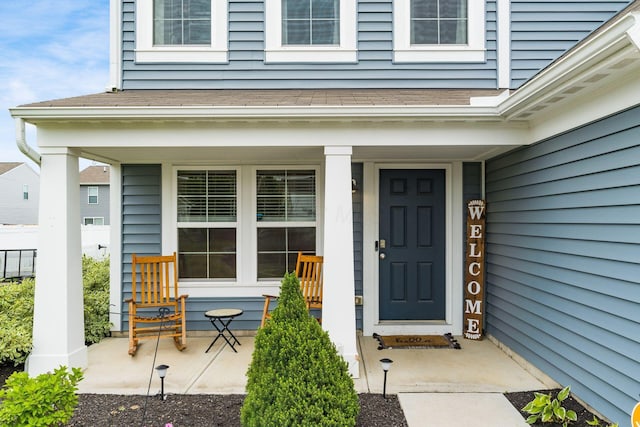 5070 River Bend Dr, South Bloomfield, OH 43103 - view of exterior entry with a porch and roof with shingles