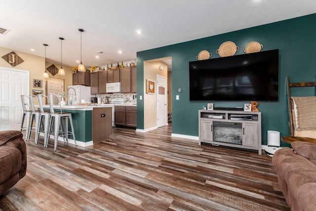 5070 River Bend Dr, South Bloomfield, OH 43103 - kitchen featuring open floor plan, white appliances, light countertops, dark wood-style flooring, and recessed lighting