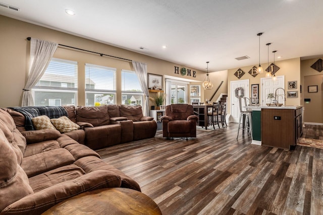 5070 River Bend Dr, South Bloomfield, OH 43103 - living room featuring dark wood-style floors, plenty of natural light, stairway, and recessed lighting